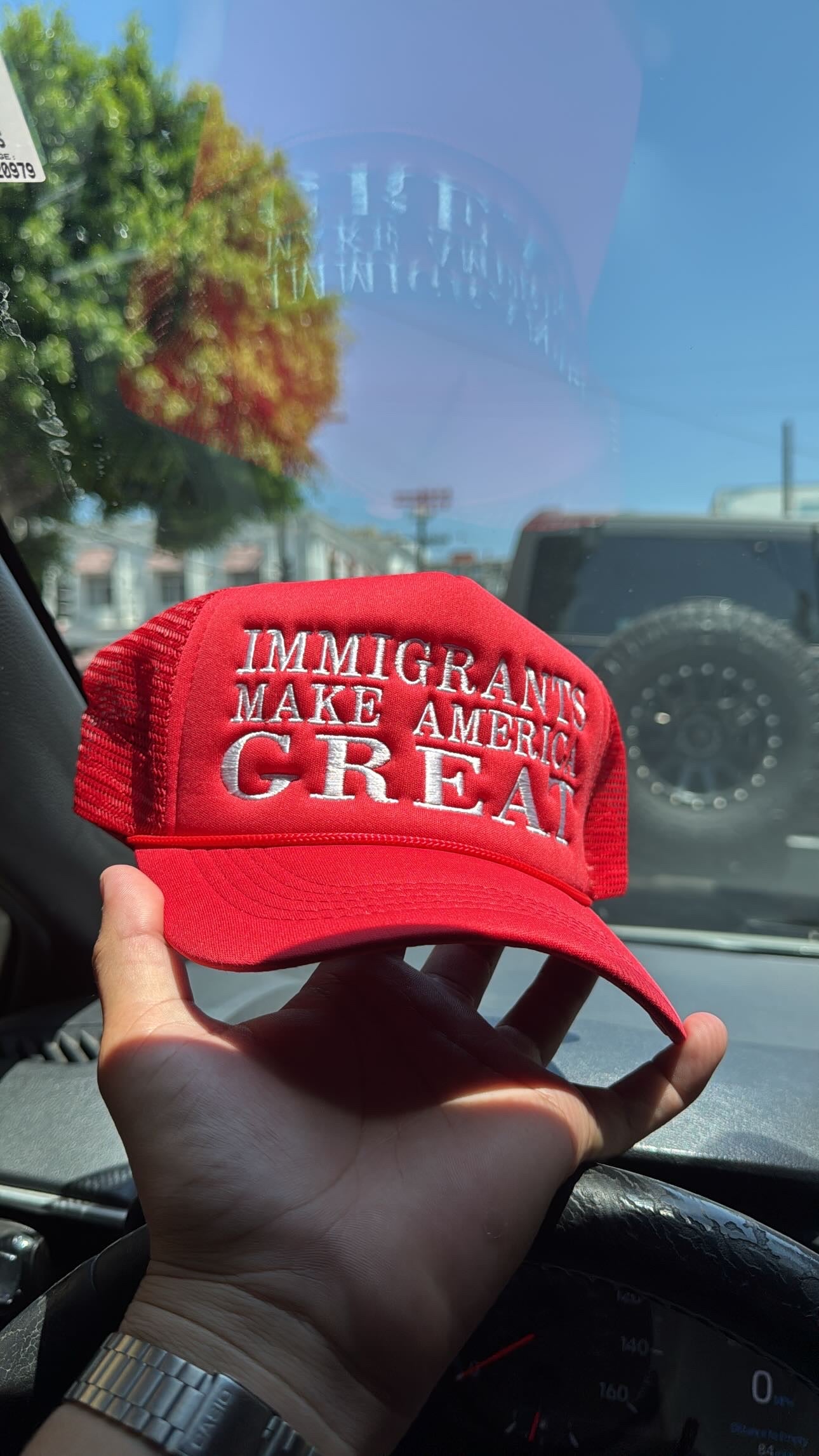 IMMIGRANTS MAKE AMERICA GREAT TRUCKER HAT