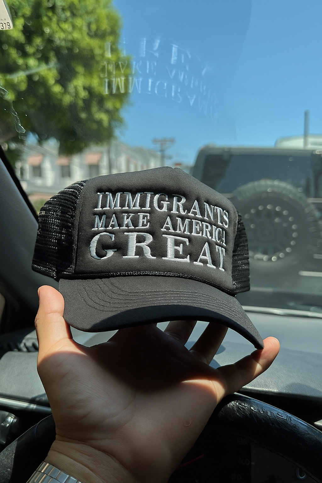 IMMIGRANTS MAKE AMERICA GREAT TRUCKER HAT