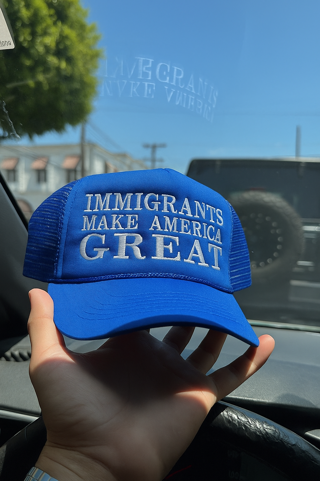 IMMIGRANTS MAKE AMERICA GREAT TRUCKER HAT